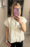 Camicia con chiusura alamari .