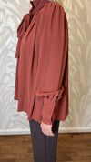 Blusa con trappeggio