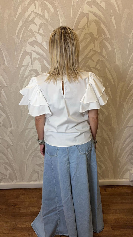 Blusa con maniche a volant